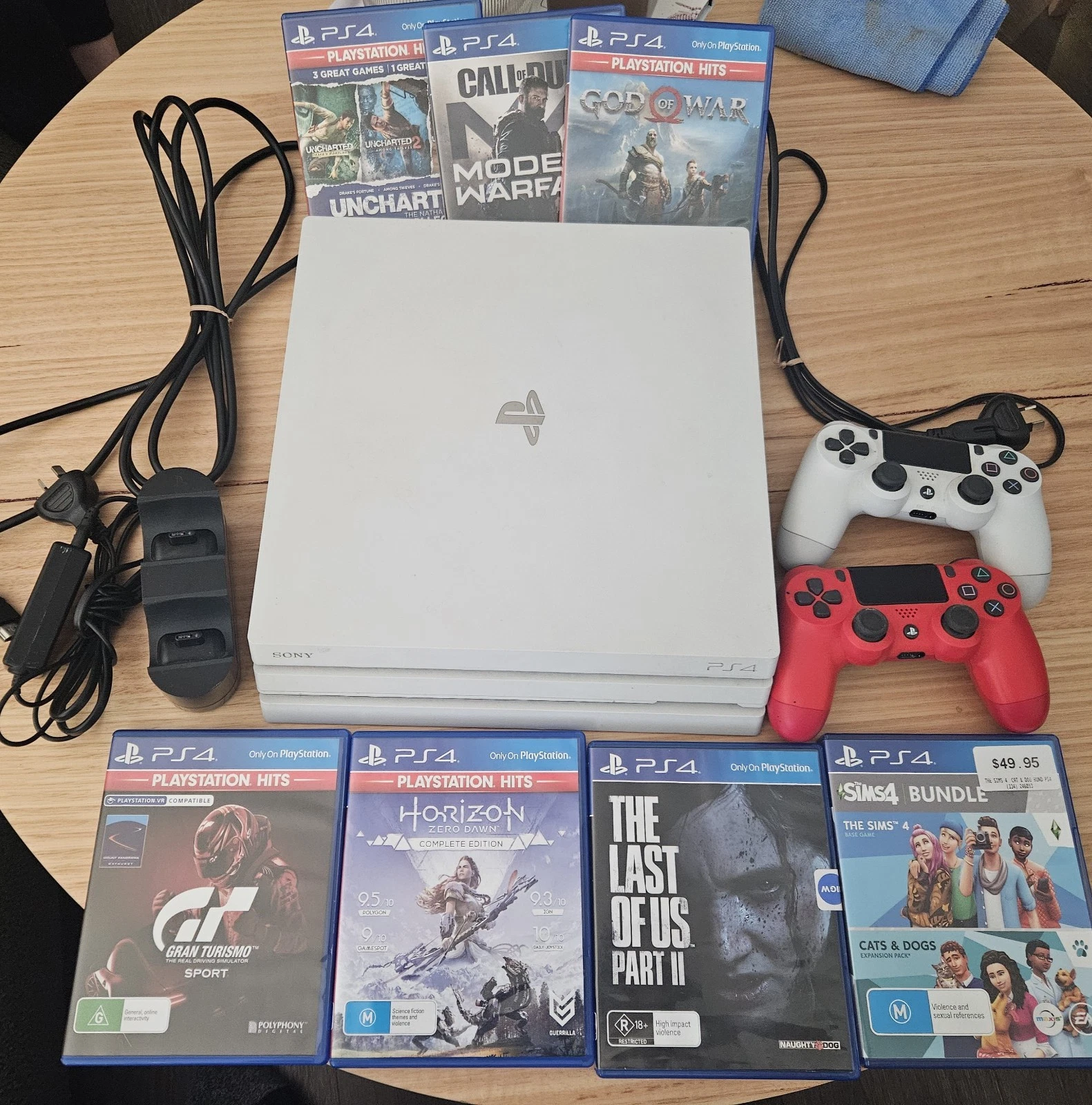 PS4 PRO 1TB White Console 2 Wireless Controllers, Charging Dock & 7 Games thumbnail 1