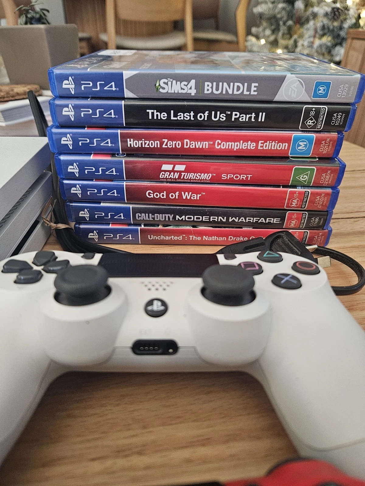 PS4 PRO 1TB White Console 2 Wireless Controllers, Charging Dock & 7 Games thumbnail 2